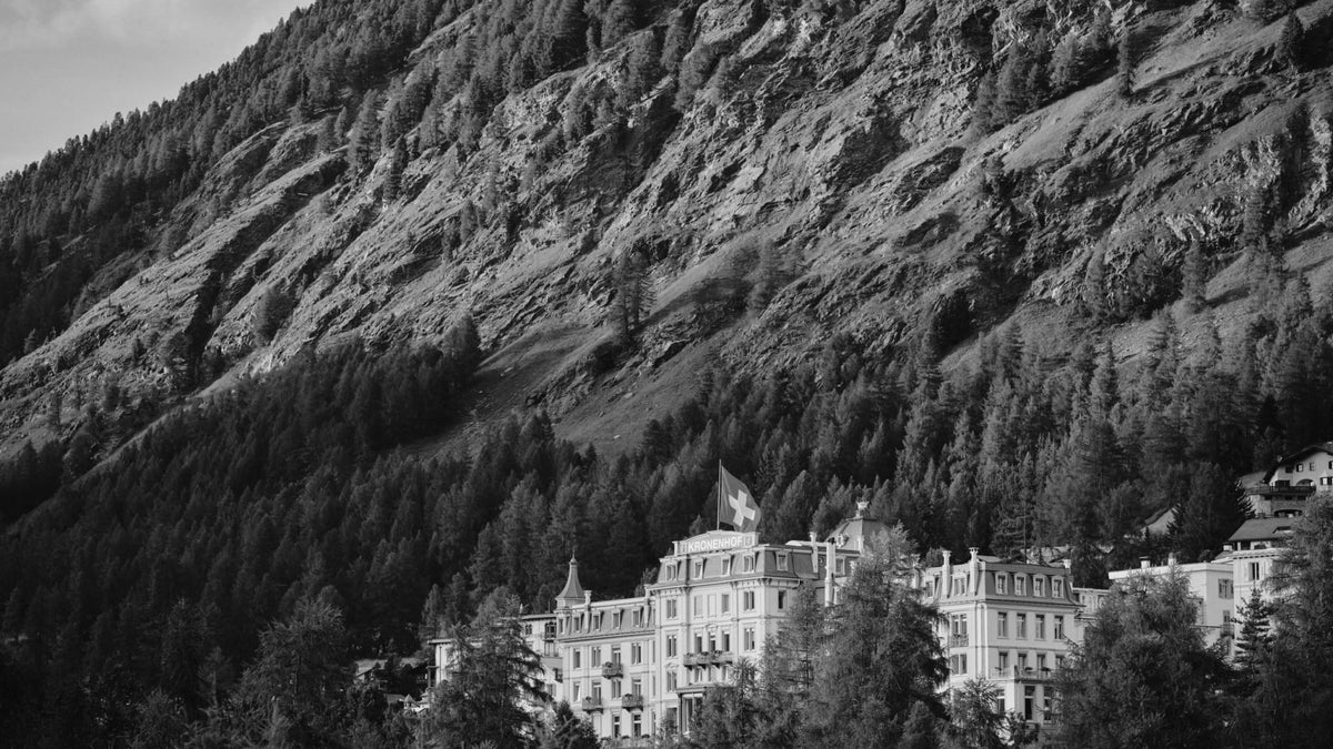 Grand Hotel Kronenhof Pontresina surrounded by golden larch trees in the Engadin