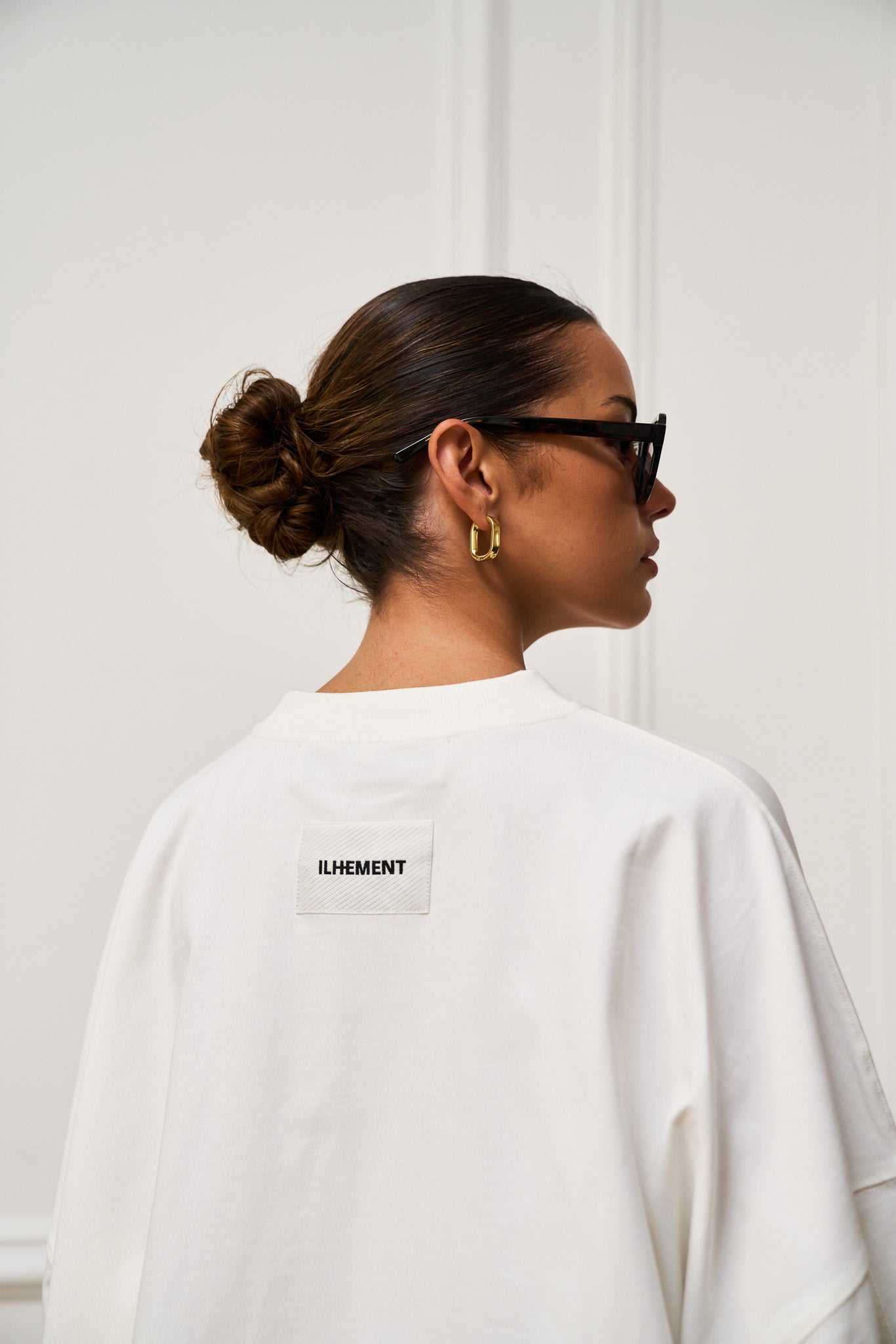 Cropped boxy long sleeve T-shirt with architectural seaming and tonal ILHEMENT logo print