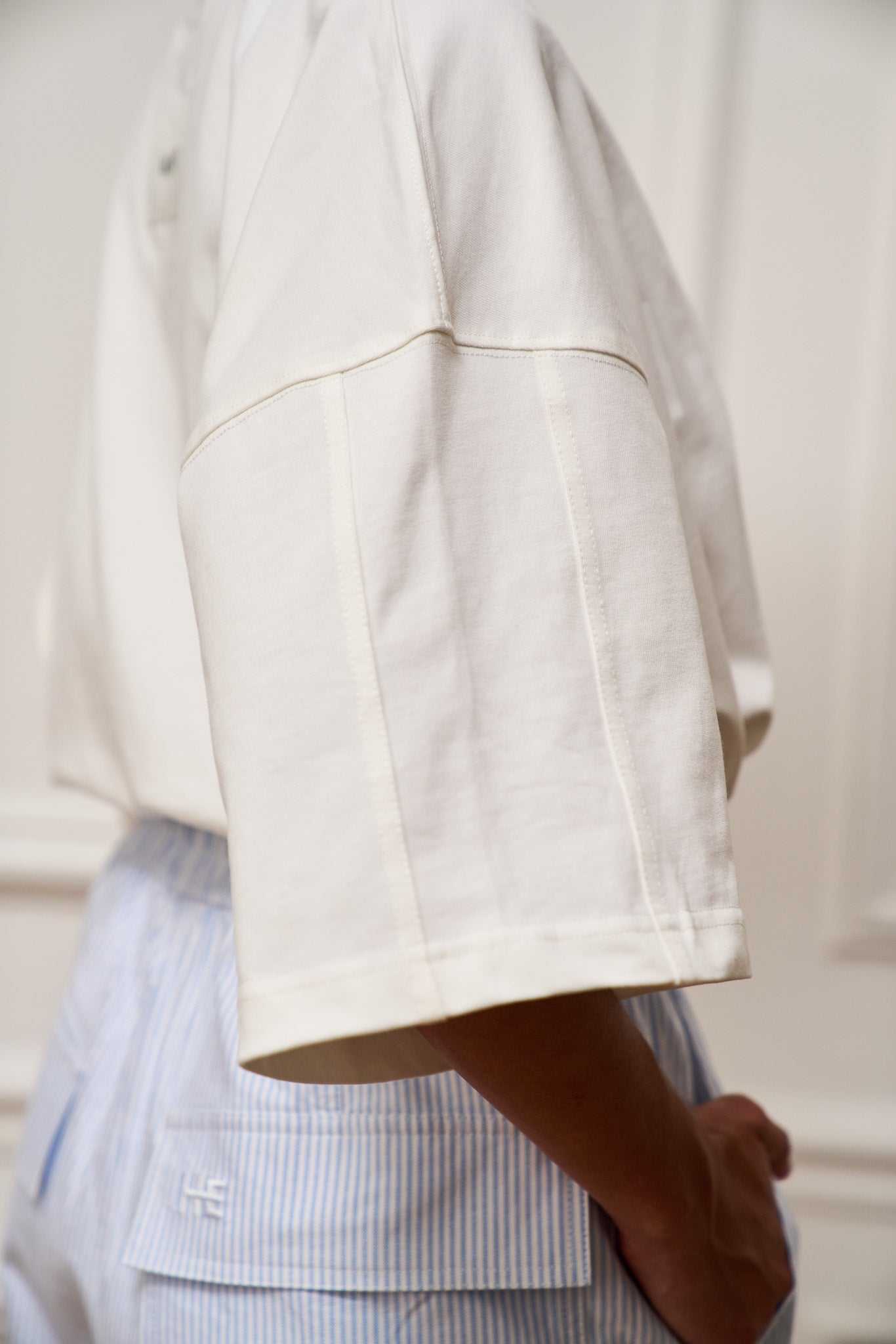 Cropped oversized cotton T-shirt with architectural seaming and tonal ILHEMENT logo