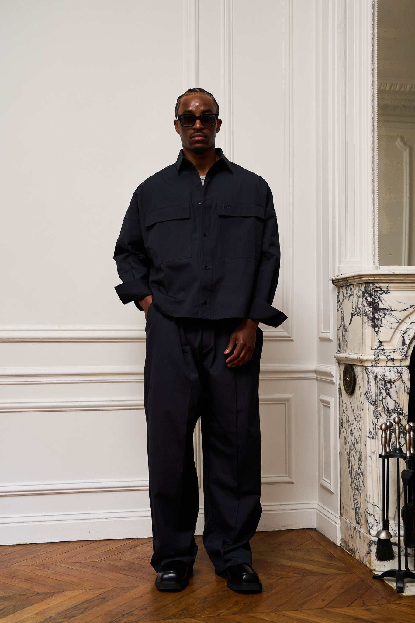 Navy pants pleated ripstop cotton oversized silhouette with stitched-down front pleats and HE embroidery