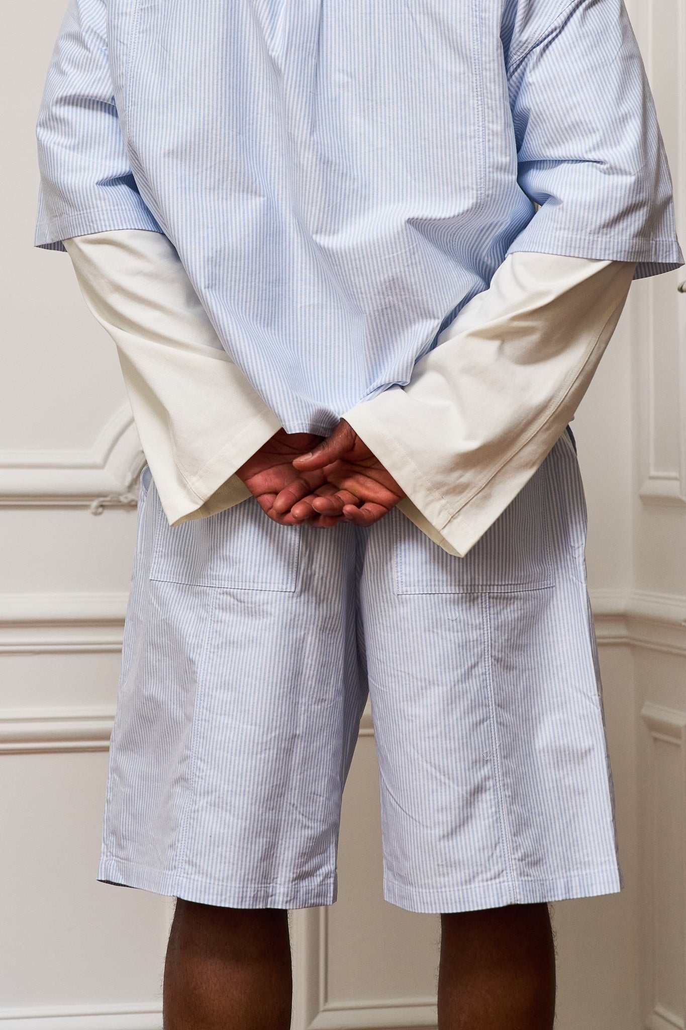 Pleated Oxford boxer shorts in soft blue-and-white striped organic cotton with flap pockets and tonal embroidery