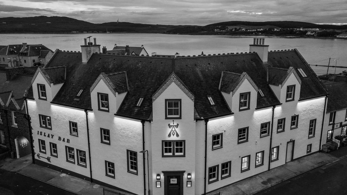 Aerial exterior view of Ardbeg House beside Port Ellen harbour on Islay