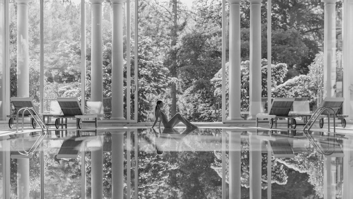 Columned indoor pool opening towards the gardens at Brenners Park-Hotel & Spa in Baden-Baden