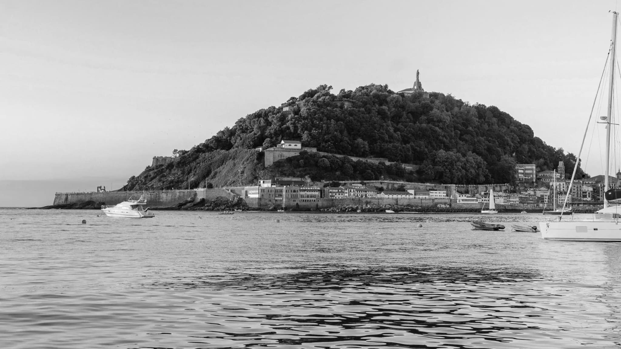 Monte Urgull and San Sebastián’s waterfront seen across the bay at sunset