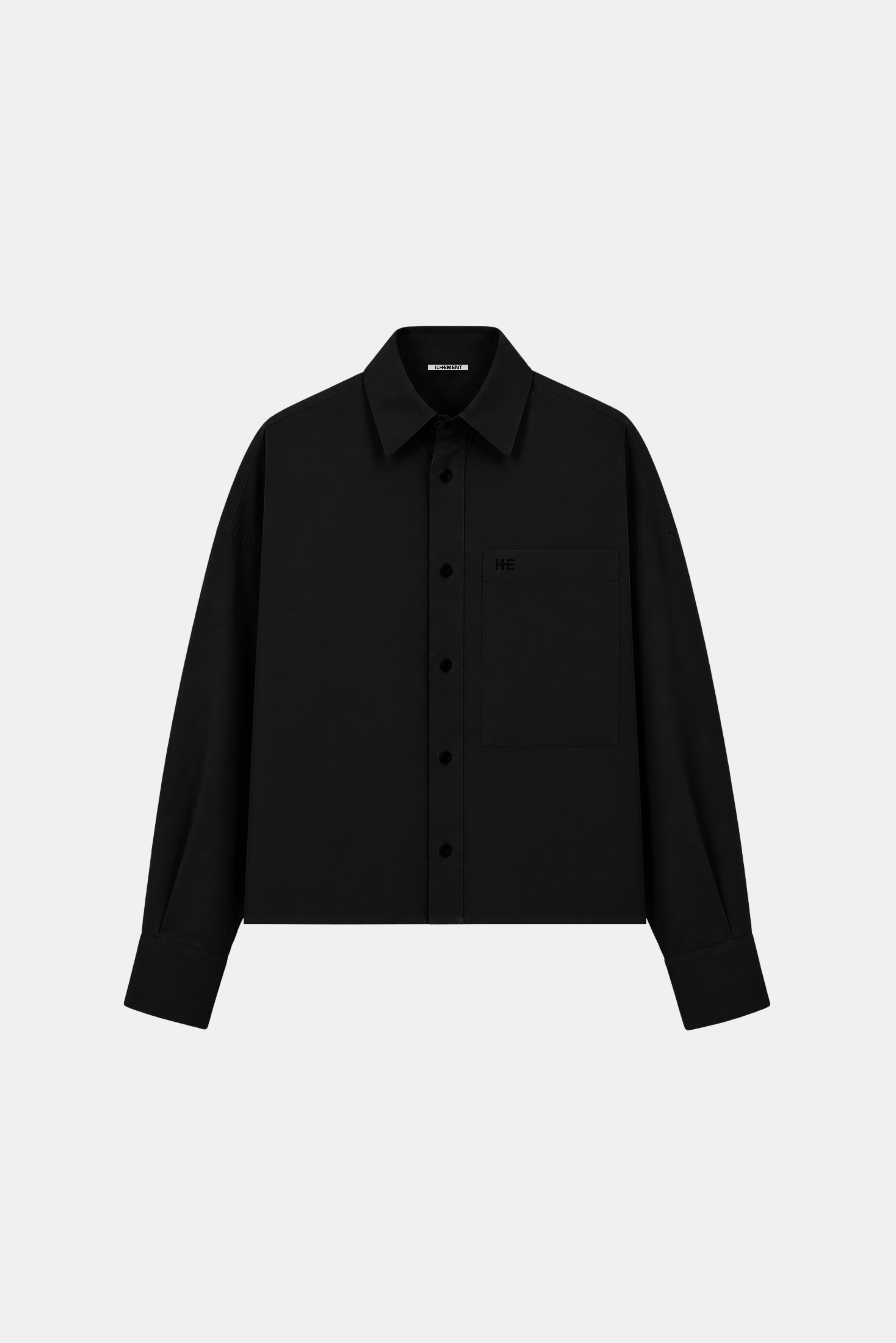A black long-sleeve button-up shirt jacket with a single chest pocket, displayed on a clean light gray background.
