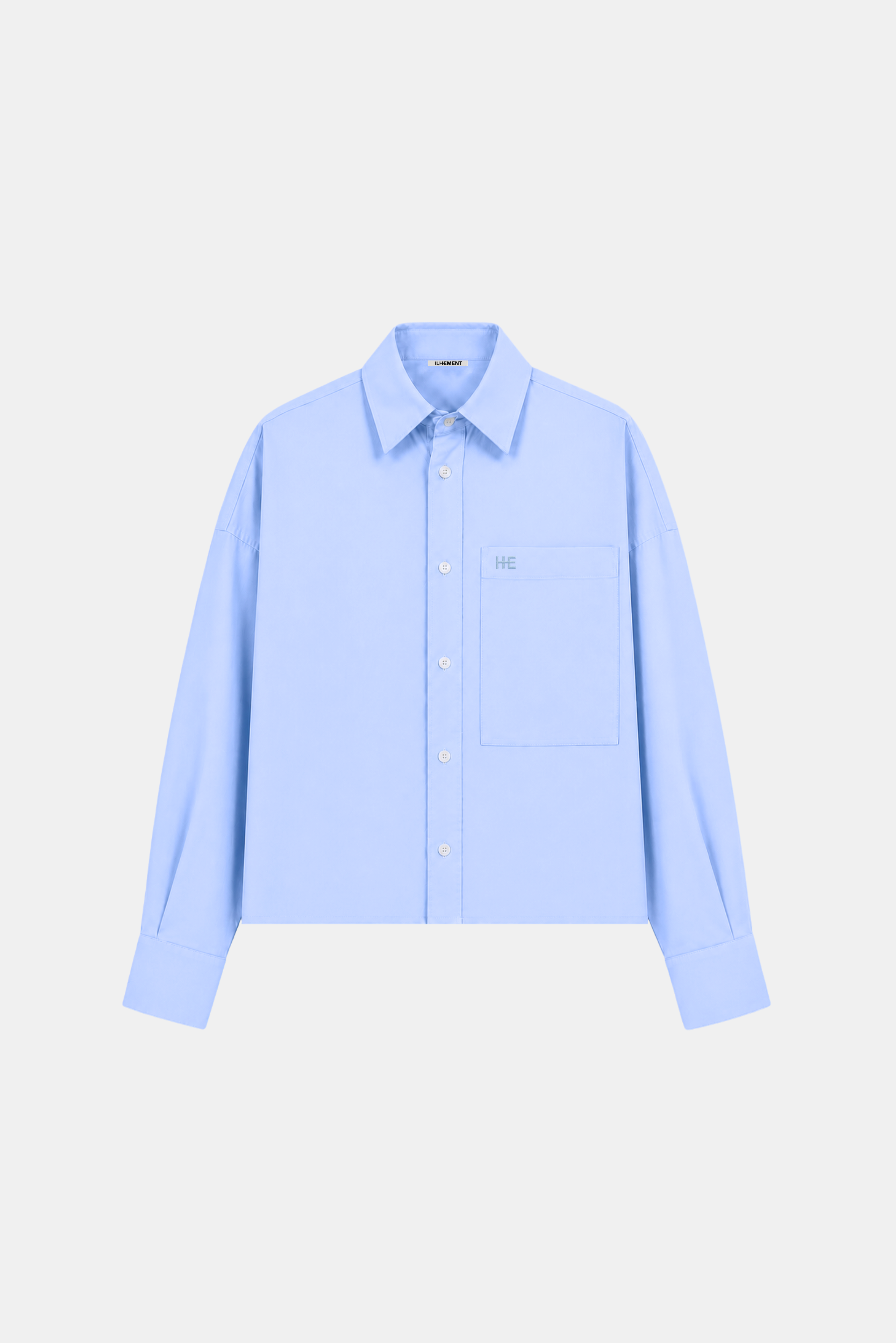 A light blue long-sleeve button-up shirt with a single chest pocket and a small embroidered logo on the pocket, displayed on a clean light gray background.